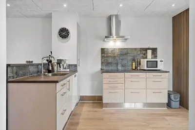 a kitchen with a sink and a microwave at G261-Lemvig-Vinkelhagevej-161 in Lemvig