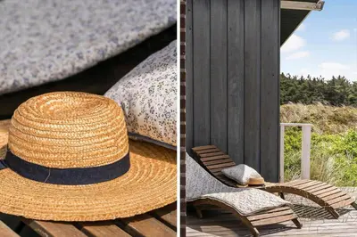 a straw hat sitting on a chair next to a building at 218-Harboore-Dalevej-6-a in Harboør