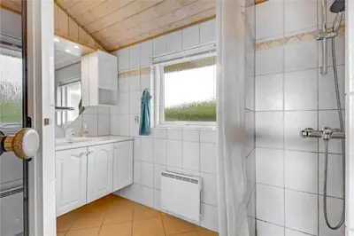 a bathroom with a shower and a sink at G131-Lemvig-Skovstjernevej-31 in Lemvig