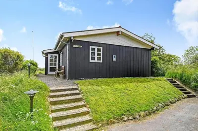a black house with stairs in front of it at G107-Lemvig-Sogardevejen-7 in Lemvig