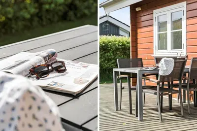 a table and chairs on a deck with a pair of sunglasses at G119-Lemvig-Klovervej-19 in Lemvig