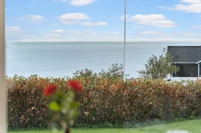 a view of the ocean from a yard with a house at G281-Lemvig-Syrenvej-81 in Lemvig