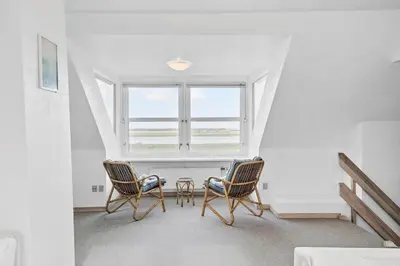 two chairs and a table in a room with a window at 369-Lemvig-Klostervej-39 in Lemvig