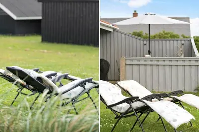 a group of chairs and an umbrella in a yard at 134-Harboore-Karolinevej-8 in Harboør