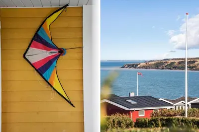 a kite hanging on the side of a house at G147-Lemvig-Syrenvej-47 in Lemvig