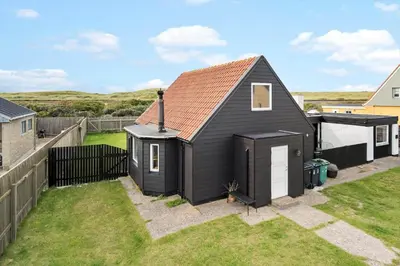 a black tiny house in a yard at 724-Thyboron-Kirkevej-9 in Thyborøn