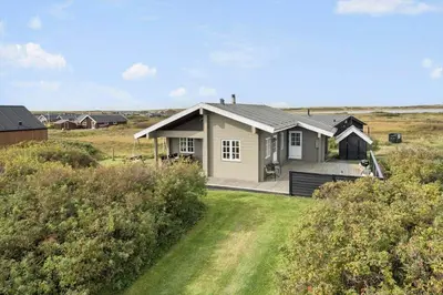 a small house in the middle of a field at 527-Lemvig-Lyngsletten-38 in Lemvig