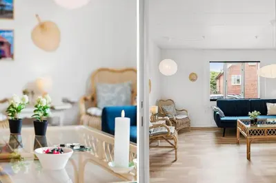 a living room with a blue couch and a table at 727-Thyboron-Magevej-10 in Thyborøn