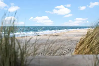a view of a beach with the ocean at 807-Harboore-Dalevej-9 in Harboør