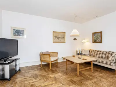 a living room with a couch and a table at 5 person holiday home in Løgstør in Løgstør
