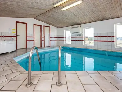 a large swimming pool in a building at 10 person holiday home in Harboøre-By Traum in Harboør