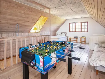 a large room with a foosball table in it at 6 person holiday home in Thyholm in Thyholm