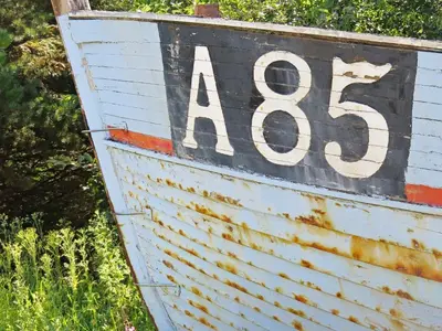 a sign on the side of a boat in the grass at 7 person holiday home in Fjerritslev-By Traum in Fjerritslev