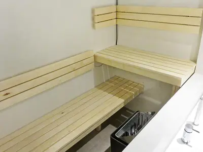 a small kitchen with two wooden benches in it at 7 person holiday home in Fjerritslev-By Traum in Fjerritslev