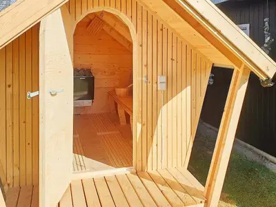 a large wooden sauna with an open door at 8 person holiday home in Vinderup-By Traum in Vinderup