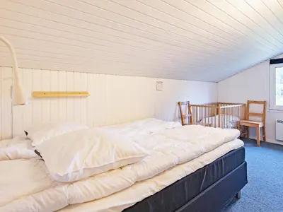 a bedroom with two beds in a room at Luxury Pool House Retreat - By Traum Ferienwohnungen in Saltum