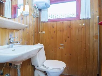 a bathroom with a toilet and a sink at 6 person holiday home in Struer-By Traum in Struer