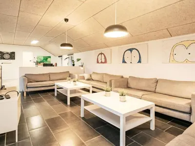 a living room with couches and tables at Holiday home for 24 guests, Brovst in Brovst