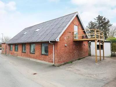 a red brick building with a metal roof at 10 person holiday home in Karby-By Traum in Karby