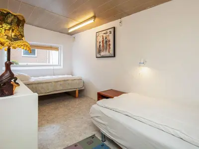 a bedroom with two beds and a window at 10 person holiday home in Karby-By Traum in Karby