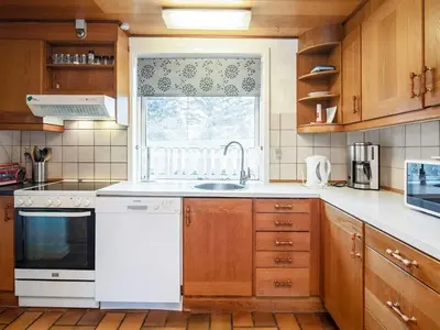 a kitchen with a white sink and a window at 10 person holiday home in Karby-By Traum in Karby