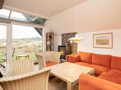 a living room with a couch and a table at 6 person holiday home in Pandrup-By Traum in Pandrup