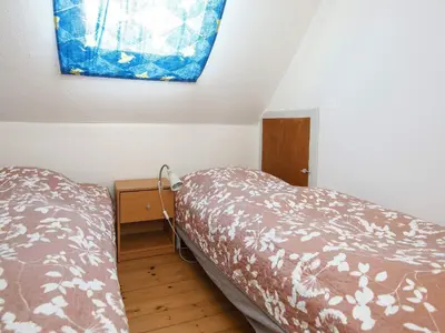 a bedroom with a bed and a window on the wall at 8 person holiday home in Thyborøn-By Traum in Thyborøn