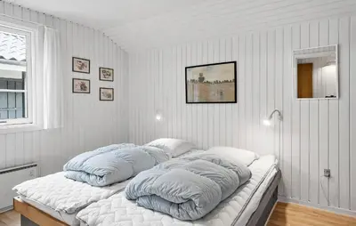 two pillows on a bed in a room at Cozy Home In Vestervig With Sauna in Vestervig