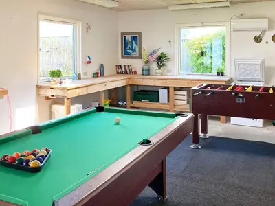a living room with a pool table and counters at 6 person holiday home in Thyborøn-By Traum in Thyborøn