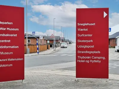 a red sign on the side of a street at 6 person holiday home in Thyborøn-By Traum in Thyborøn