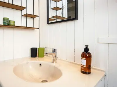 a soap bottle sitting on a bathroom sink at 8 person holiday home in Lemvig-By Traum in Lemvig