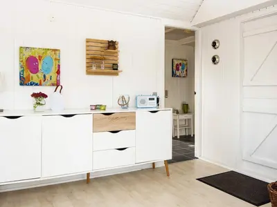 a kitchen with white cabinets and a door at 8 person holiday home in Lemvig-By Traum in Lemvig