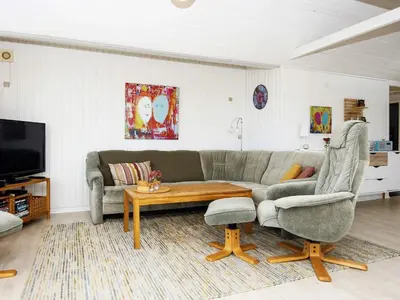 a living room with a couch and a coffee table at 8 person holiday home in Lemvig-By Traum in Lemvig
