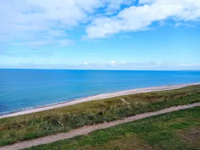 a view of the beach from a bluff at 6 person holiday home in Fjerritslev in Fjerritslev