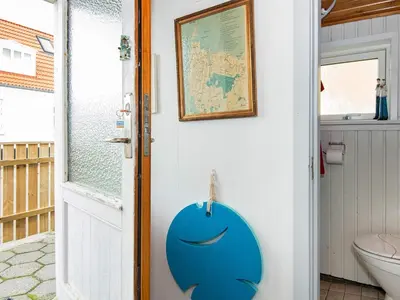 a door with a blue face painted on it at 5 person holiday home in Thyborøn in Thyborøn