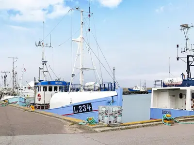 a group of boats docked at a dock at 5 person holiday home in Thyborøn in Thyborøn