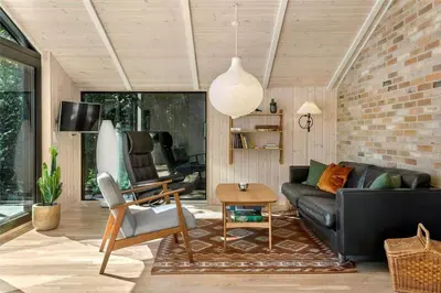 a living room with a couch and a table at LF473-Thisted-Asvej-73 in Thisted
