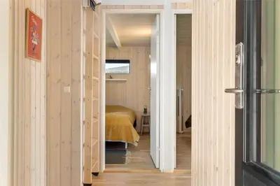 a hallway leading to a bedroom with a bed at LF473-Thisted-Asvej-73 in Thisted