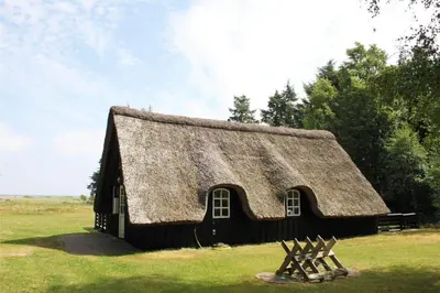 an old barn with a thatched roof on a field at LF14258-Fur-Marehalmvej-8 in Fur