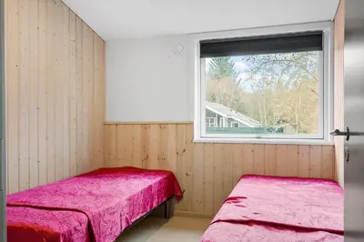 two beds in a room with a window at LF10320-Hurup-Thy-Nattergalevej-2-B in Sønder Ydby