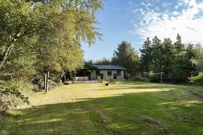 a house in the middle of a yard at LF10236-Thyholm-Svinget-18 in Thyholm