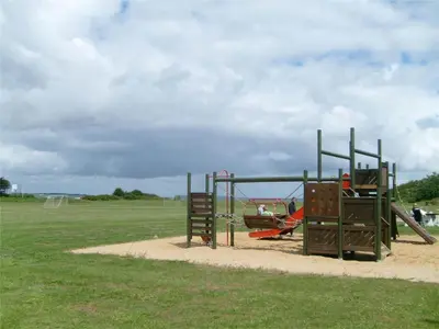 a playground with a slide in a field at LF14038-Roslev-Stranddalen-119 in Roslev
