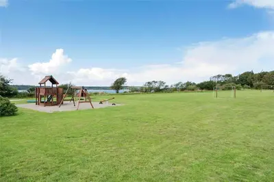 an empty park with a playground in a field at LF14163-Roslev-Kybehuse-3 in Roslev