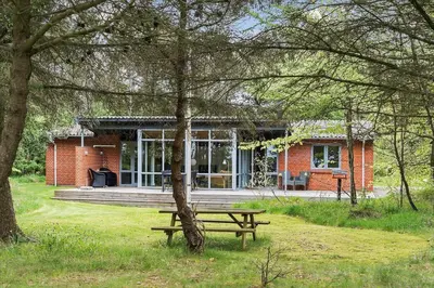 a picnic bench in front of a brick house at LF449-Hurup-Thy-Strandskadevej-11 in Sindrup