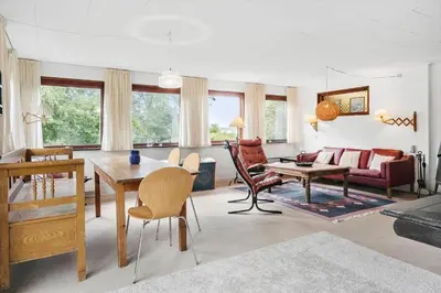 a living room with a couch and a table at LF10213-Thyholm-Haervej-9-B in Thyholm