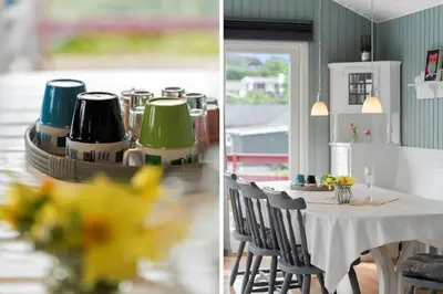 a dining room with a table with chairs and a room with aqual at LF11171-Struer-Klintevej-14 in Struer