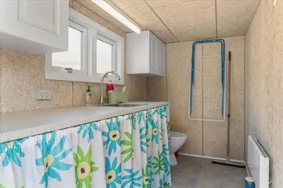 a bathroom with a sink and a shower with a toilet at LF14223-Roslev-Livovej-9 in Roslev