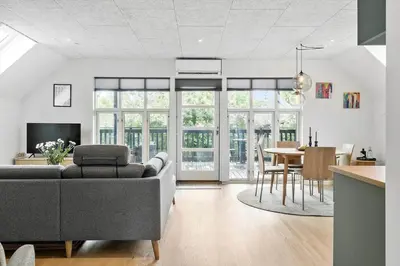 a living room with a couch and a table at LF11122-Struer-Plantagevej-22 in Struer