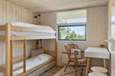 a room with bunk beds and a desk and a sink at LF11107-Struer-Skovvej-7 in Struer