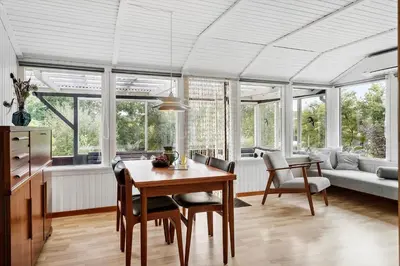 a kitchen and dining room with a table and chairs at LF11108-Struer-Barsidalvej-8 in Struer